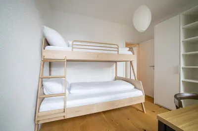 Ein Bett oder Betten in einem Zimmer der Unterkunft Apartment Harderstrasse