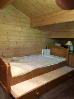 Ein Bett oder Betten in einem Zimmer der Unterkunft Exclusive Charming 4 Bedroom Chalet near Gstaad