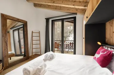 Ein Bett oder Betten in einem Zimmer der Unterkunft L'Ours des Pistes l Ski in-out l By CosyHome