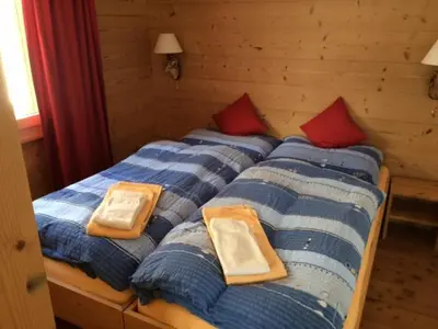 Ein Bett oder Betten in einem Zimmer der Unterkunft Chalet Tilly