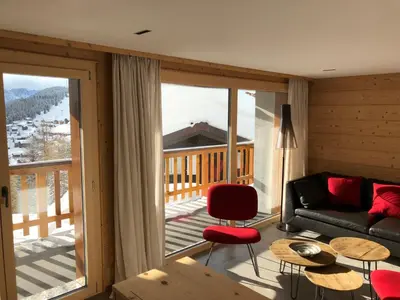 Ein Sitzbereich in der Unterkunft Chalet Tilly