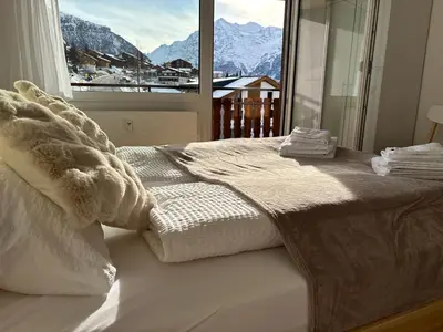 Ein Bett oder Betten in einem Zimmer der Unterkunft Sunny Alps View Central Bliss 2