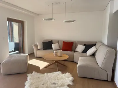 Ein Sitzbereich in der Unterkunft Cozy Crans-Montana Apt with Lake and Mountain View