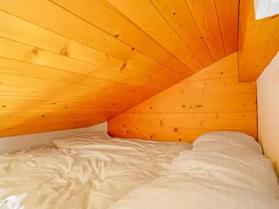 Ein Bett oder Betten in einem Zimmer der Unterkunft Cozy Chalet Apartment in the Heart of Lenk