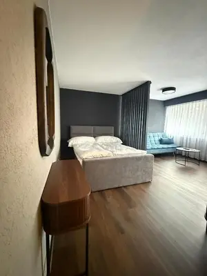 Ein Bett oder Betten in einem Zimmer der Unterkunft Moderne Wohnung mit Bergblick und nahe Thunersee