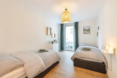 Ein Bett oder Betten in einem Zimmer der Unterkunft Central Alpine Stay - Modern & Free Parking