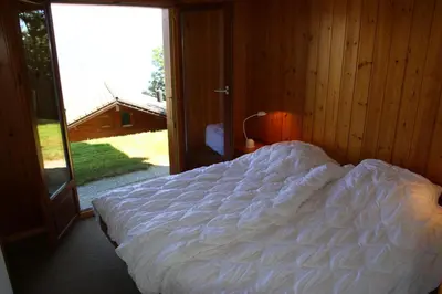 Ein Bett oder Betten in einem Zimmer der Unterkunft Fontannets 001 COSY & MOUNTAIN chalet 10 pers