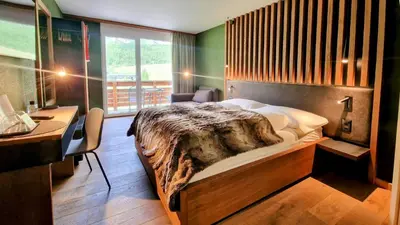 Ein Bett oder Betten in einem Zimmer der Unterkunft Amber Ski-in/out Hotel & Spa