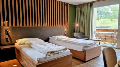 Ein Bett oder Betten in einem Zimmer der Unterkunft Amber Ski-in/out Hotel & Spa