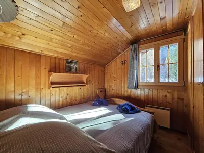 Ein Bett oder Betten in einem Zimmer der Unterkunft Chalet Le Camée