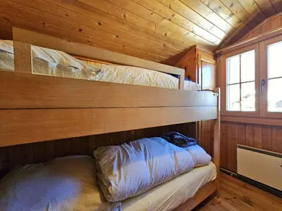 Ein Bett oder Betten in einem Zimmer der Unterkunft Chalet Le Camée