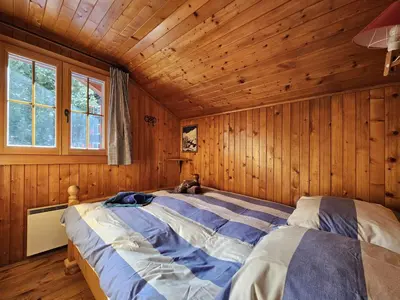 Ein Bett oder Betten in einem Zimmer der Unterkunft Chalet Le Camée