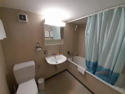 Ein Badezimmer in der Unterkunft Tschuggen Apartment - No Kitchen