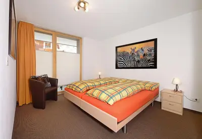 Ein Bett oder Betten in einem Zimmer der Unterkunft Ferienwohnung Haus Achilles