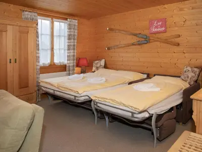 Ein Bett oder Betten in einem Zimmer der Unterkunft Apartment Chäs Gruebi Apt-S by Interhome
