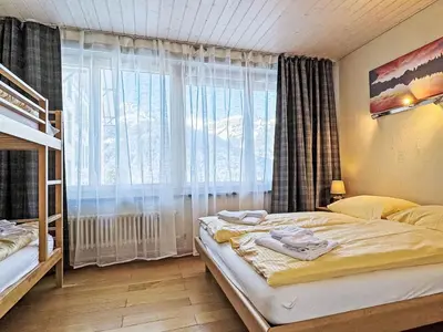 Ein Bett oder Betten in einem Zimmer der Unterkunft Apartment Haus Gertsch Apt-G by Interhome
