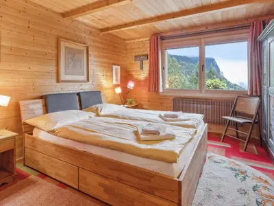 Ein Bett oder Betten in einem Zimmer der Unterkunft Chalet Mioche by Interhome