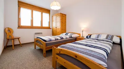 Ein Bett oder Betten in einem Zimmer der Unterkunft Christiania