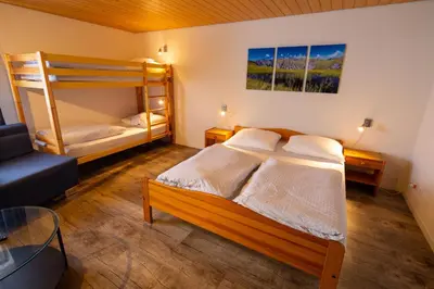 Ein Bett oder Betten in einem Zimmer der Unterkunft Hotel Restaurant Simplon
