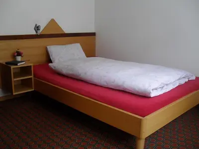 Ein Bett oder Betten in einem Zimmer der Unterkunft Hotel Restaurant Aletsch