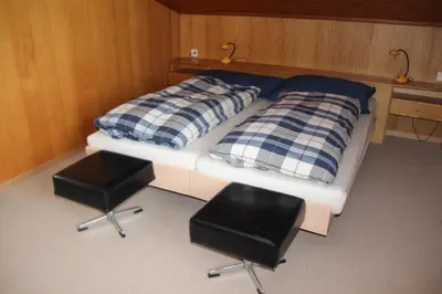 Ein Bett oder Betten in einem Zimmer der Unterkunft Chalet Mittaghorn