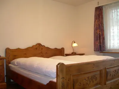 Ein Bett oder Betten in einem Zimmer der Unterkunft Hotel Crystal Interlaken