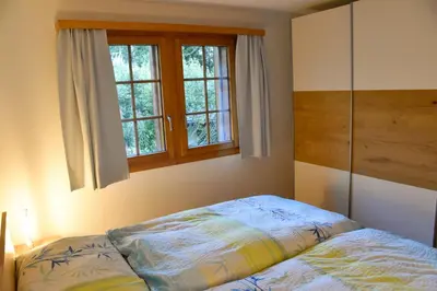 Ein Bett oder Betten in einem Zimmer der Unterkunft Haus Brunnen (Anton Karlen)