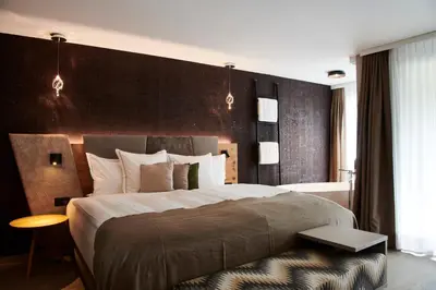 Ein Bett oder Betten in einem Zimmer der Unterkunft Matthiol Boutique Hotel