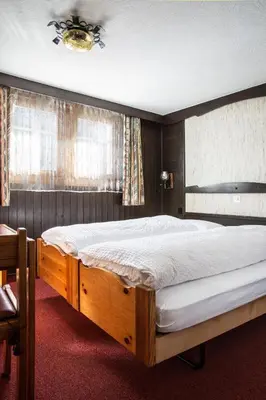 Ein Bett oder Betten in einem Zimmer der Unterkunft Hotel Burgener