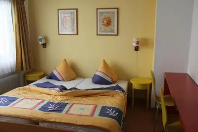 Ein Bett oder Betten in einem Zimmer der Unterkunft Pension Heino