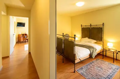Ein Bett oder Betten in einem Zimmer der Unterkunft Locanda Villa d' Epoca