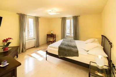 Ein Bett oder Betten in einem Zimmer der Unterkunft Locanda Villa d' Epoca