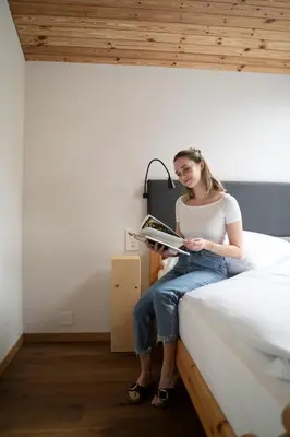 Ein Bett oder Betten in einem Zimmer der Unterkunft Bergblick Lodge - 3 Sterne Garni