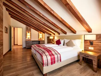 Ein Bett oder Betten in einem Zimmer der Unterkunft Hotel Ambassador Zermatt
