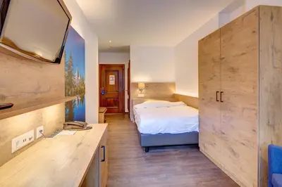 Ein Bett oder Betten in einem Zimmer der Unterkunft Alpen Resort & Spa