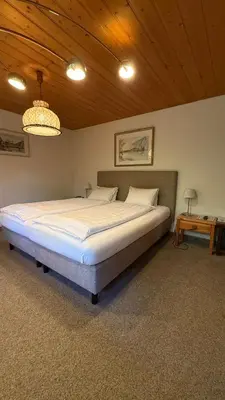 Ein Bett oder Betten in einem Zimmer der Unterkunft Hotel Châlet Du Lac