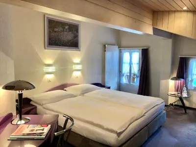 Ein Bett oder Betten in einem Zimmer der Unterkunft Hotel Châlet Du Lac