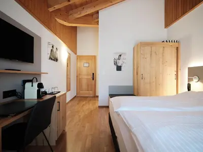 Ein Bett oder Betten in einem Zimmer der Unterkunft Hotel Hubertus