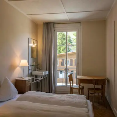 Ein Bett oder Betten in einem Zimmer der Unterkunft Hotel Regina