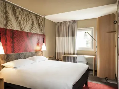 Ein Bett oder Betten in einem Zimmer der Unterkunft Ibis Sion