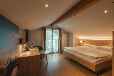 Ein Bett oder Betten in einem Zimmer der Unterkunft Hotel Matterhorn Inn