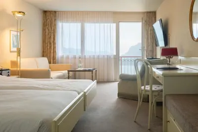 Ein Bett oder Betten in einem Zimmer der Unterkunft Seiler au Lac