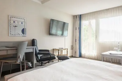 Ein Bett oder Betten in einem Zimmer der Unterkunft Seiler au Lac