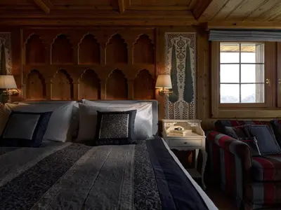 Ein Bett oder Betten in einem Zimmer der Unterkunft LeCrans