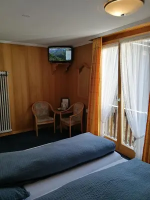 Ein Bett oder Betten in einem Zimmer der Unterkunft Petit Helvetia Budget Hotel