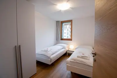 Ein Bett oder Betten in einem Zimmer der Unterkunft Alpenresort B22