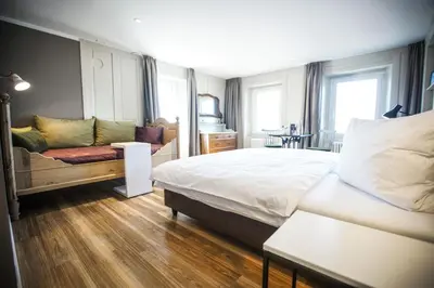 Ein Bett oder Betten in einem Zimmer der Unterkunft B&B Zum Schleif