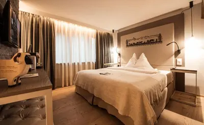 Ein Bett oder Betten in einem Zimmer der Unterkunft Hotel Daniela