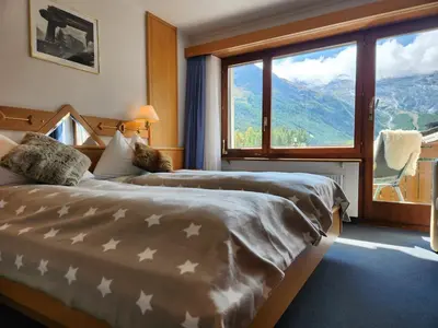 Ein Bett oder Betten in einem Zimmer der Unterkunft Hotel Etoile & Alpenperle Residences