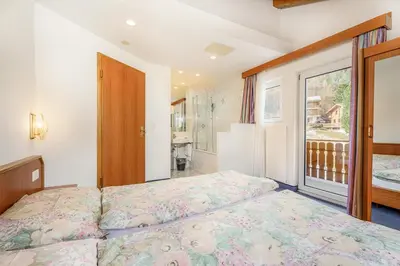 Ein Bett oder Betten in einem Zimmer der Unterkunft Hotel Etoile & Alpenperle Residences